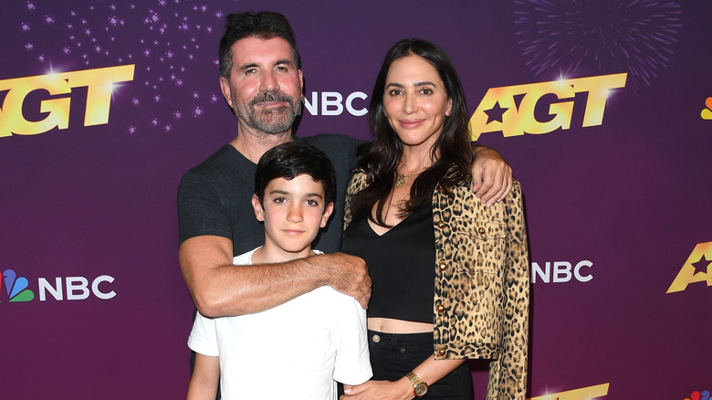 Simon Cowell poses with son Eric and fiancée Lauren Silverman
