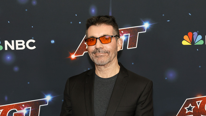 Simon Cowell posing at AGT event
