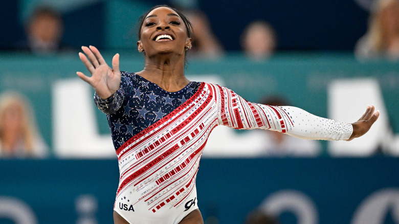 Simone Biles wearing a red, white, and blue themed leotard during the 2024 Paris Olympics