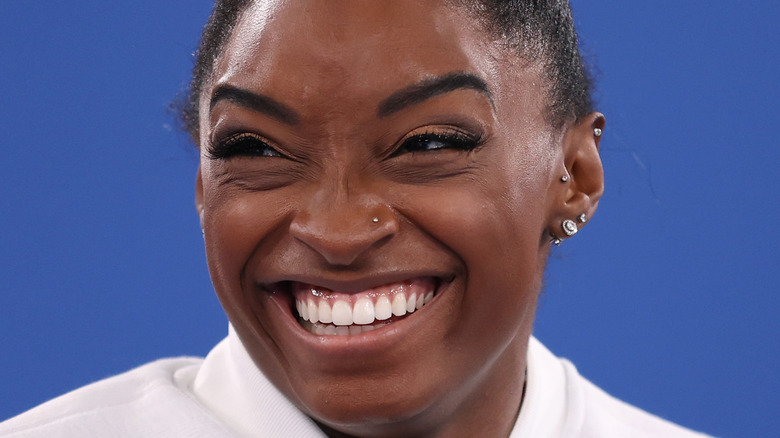 Simone Biles smiles at the Tokyo Olympics.
