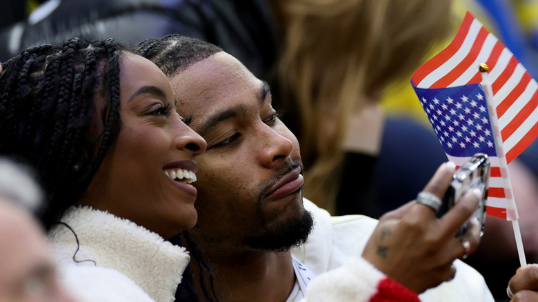 Simone Biles and Jonathan Owens taking a selfie at the 2026 Winter Olympics
