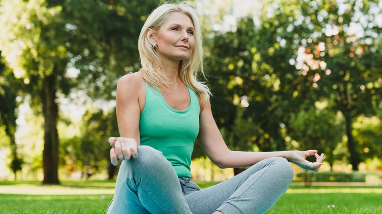 woman doing yoga outdoors