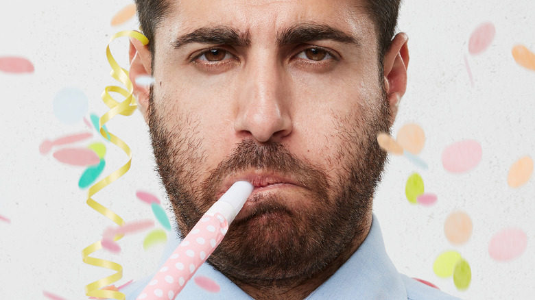 unhappy man celebrating birthday