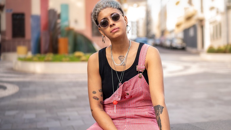 woman with tattoos on arms and chest