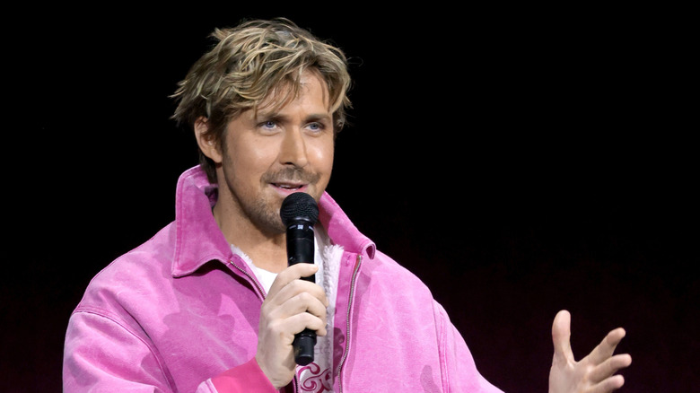 Ryan Gosling speaking into a microphone