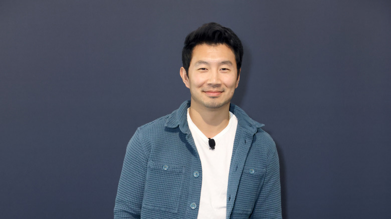 Simu Liu smiling