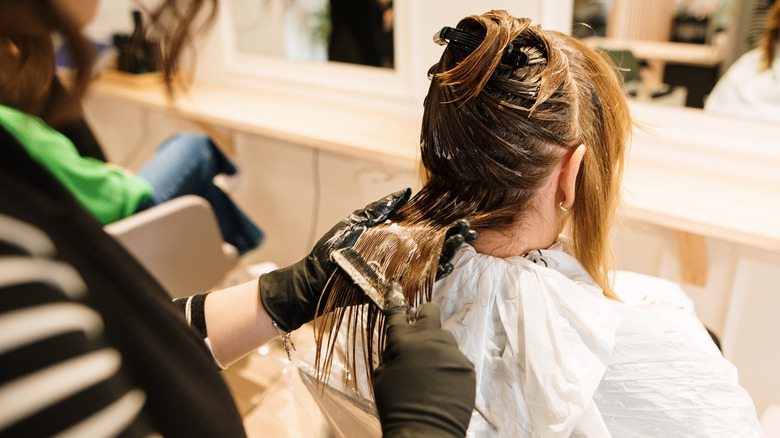 Woman getting her hair colored