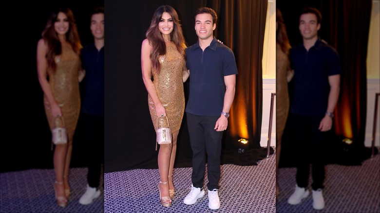 Kimberly Guilfoyle posing with her son