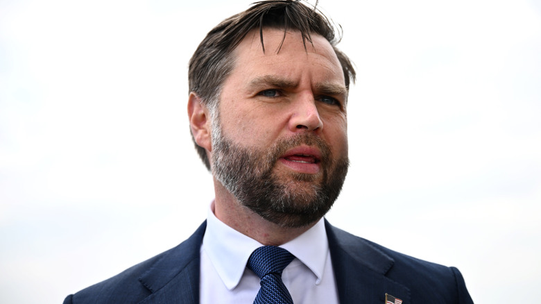 JD Vance in a suit with his mouth open