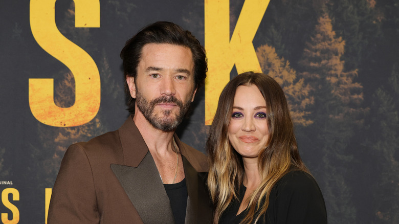 Tom Pelphrey and Kaley Cuoco smiling