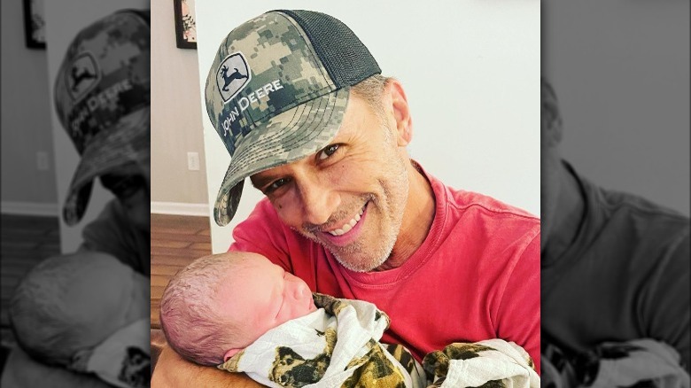 Scott Reeves holding his newborn grandson Abel Reeves