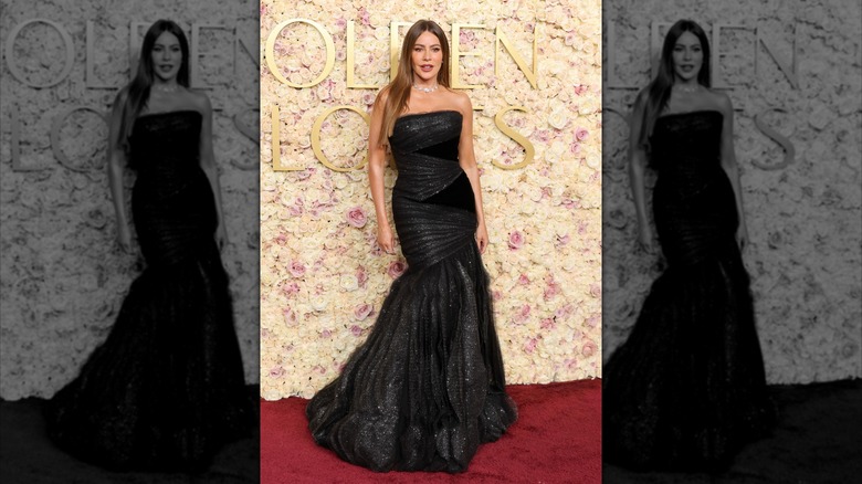 Sofía Vergara at the 82nd Annual Golden Globe Awards wearing a black faux-wrap floor-length dress