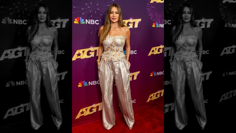 Actress Sofía Vergara at the "America's Got Talent" Season 19 Quarterfinals 1 Red Carpet at Hotel Dena on August 13, 2024, wearing a lacy silver sleeveless top and silver slacks