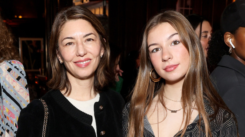 Sofia Coppola smiling next to her daughter Romy Mars