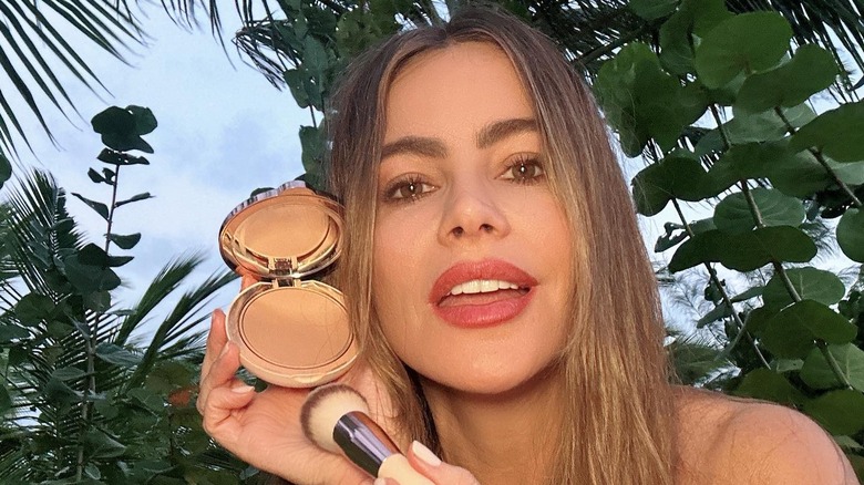 Sofia Vergara in a garden holding Toty foundation