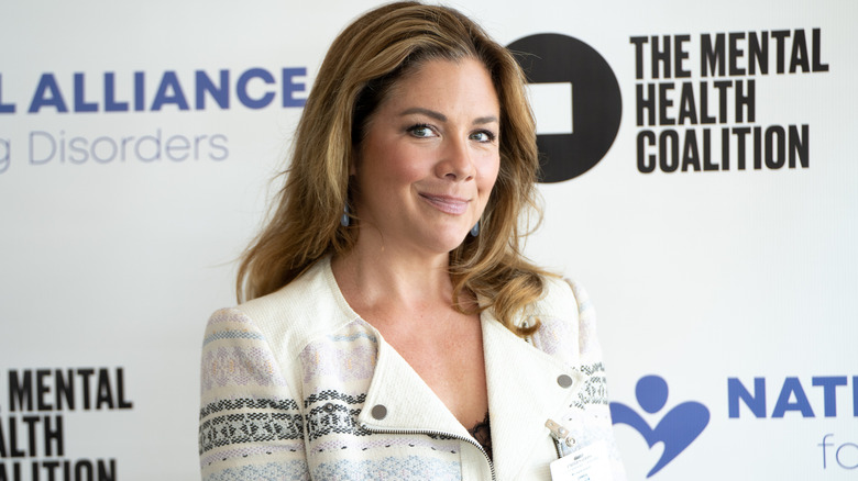 Sophie Grégoire Trudeau smiling in front of white backdrop