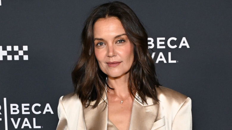 Katie Holmes smiling while posing at the Tribeca Film Festival