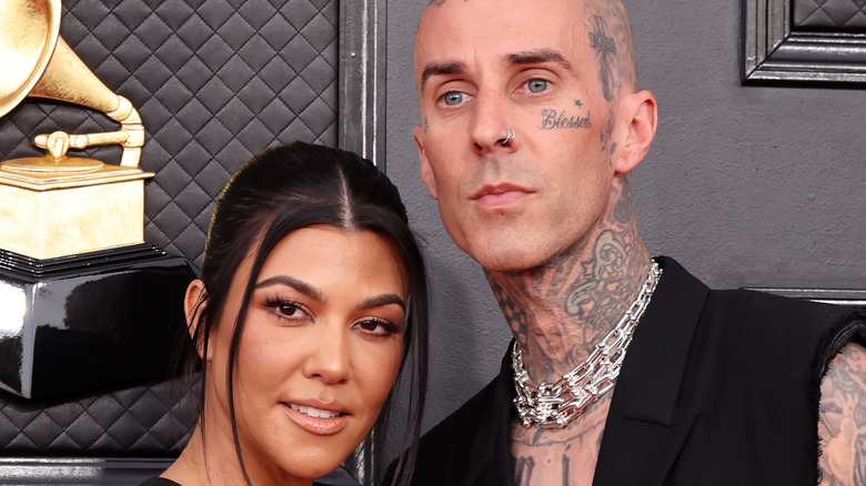 Kourtney Kardashian and Travis Barker posing