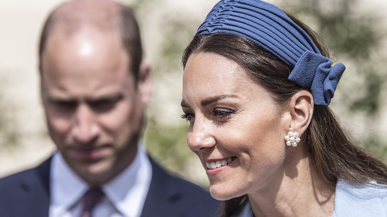 Kate Middleton and Prince William shaking hands with the public