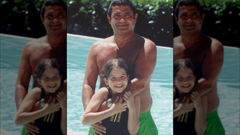 A young Naomie with her father in a pool