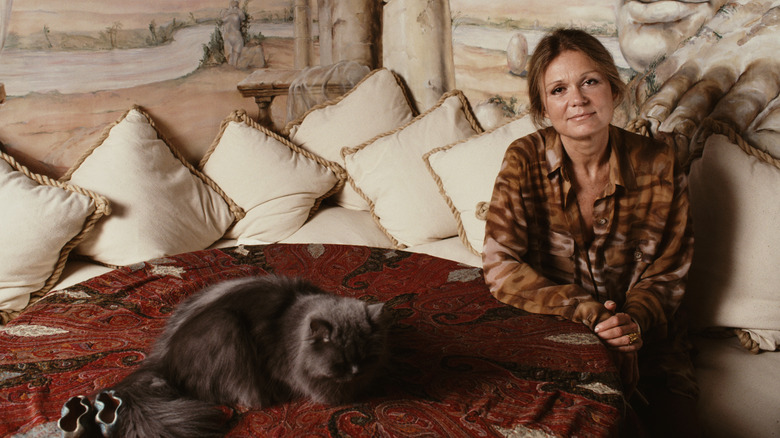 Gloria Steinem smiling with a cat