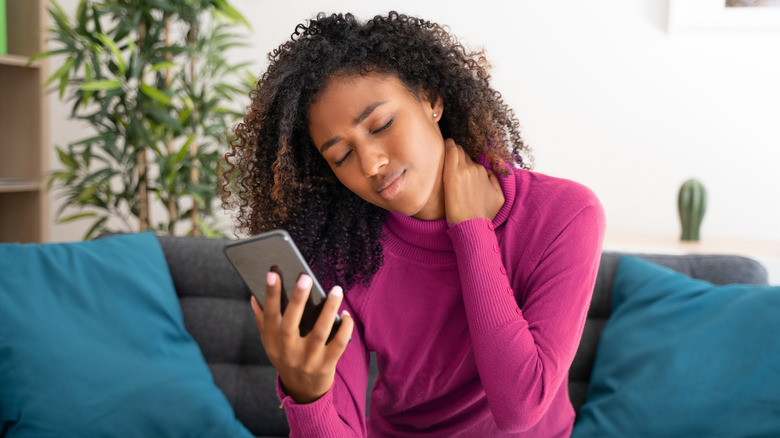 Woman staring at phone