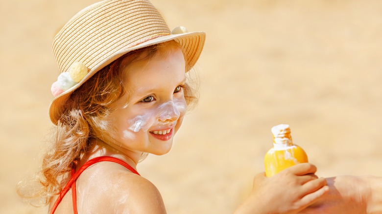 Child wearing sunscreen 