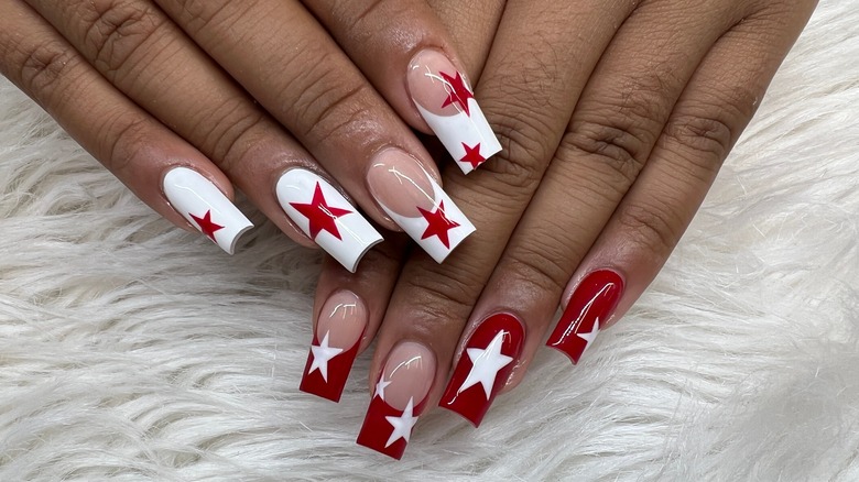 Close-up of red and white nail art with stars