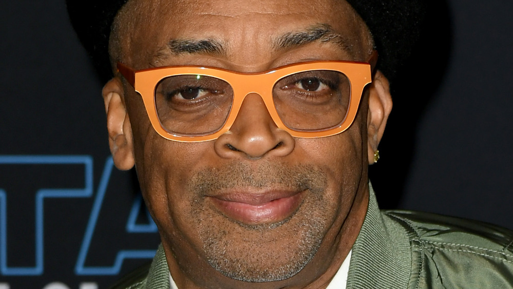 Spike Lee grinning in orange glasses