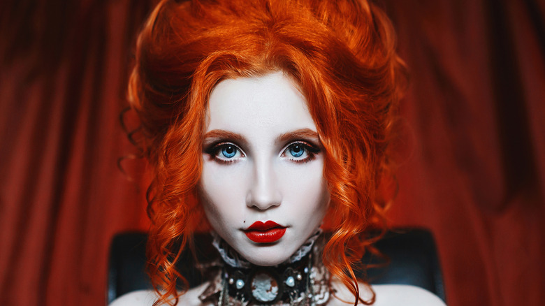 Redheaded woman in goth costume