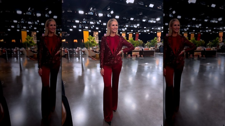 Laura Rutledge in a red suit in an expo center.