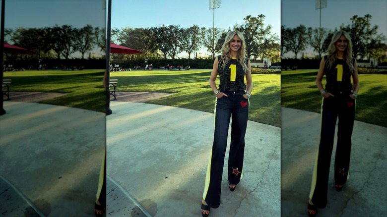 Laura Rutledge on a patio in front of a grassy background.