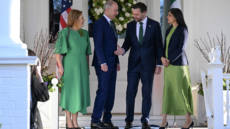 Micheál and Mary Martin smiling at JD and Usha Vance