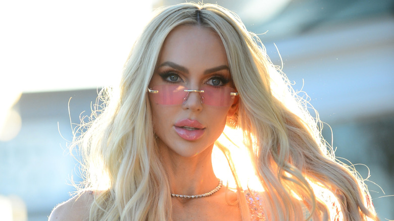 Closeup of Christine Quinn walking through Los Angeles