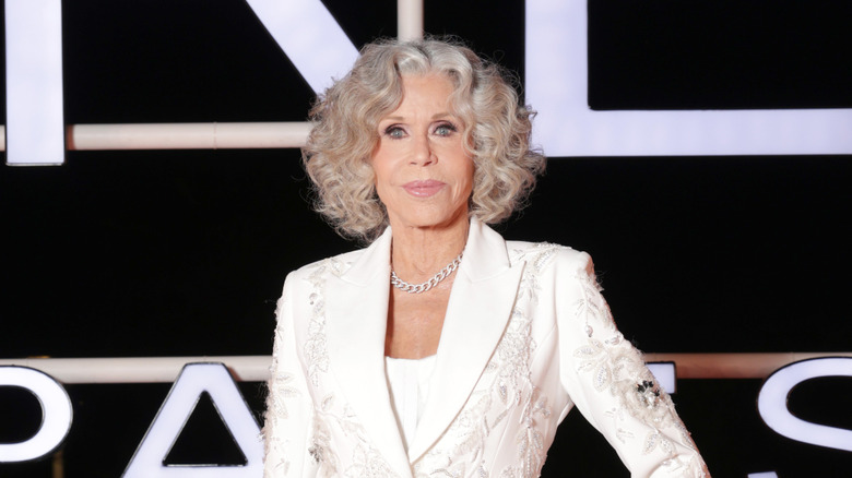 Jane Fonda posing in front of a black-and-white background