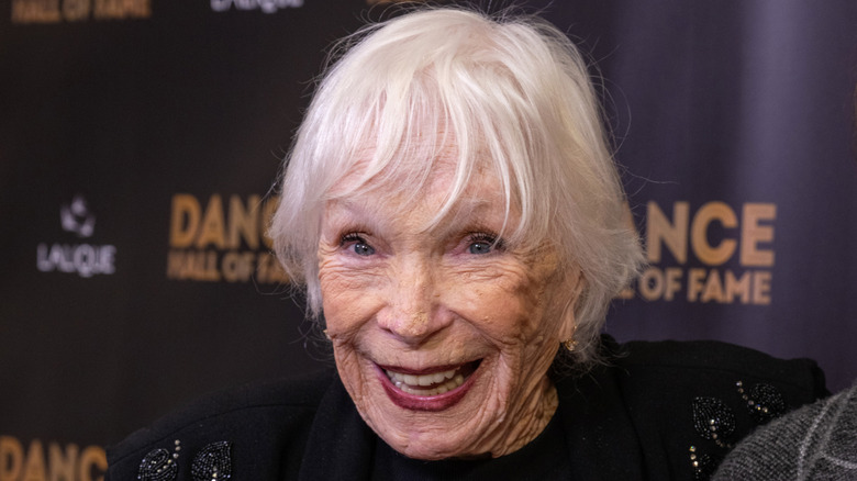 Shirley MacLaine smiling while attending industry event