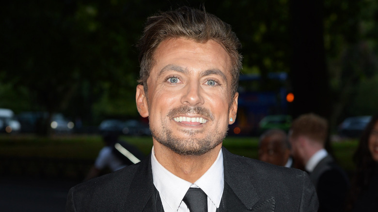 Paul Danan smiling at event in 2017