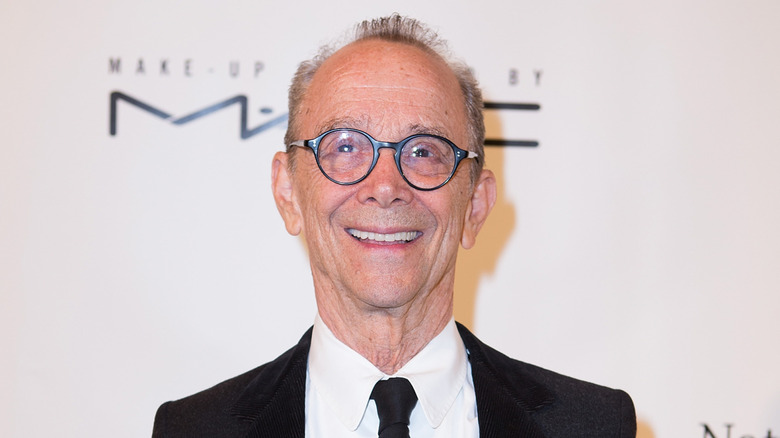 Joel Grey smiling on step-and-repeat in 2015