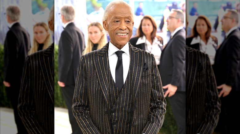 Al Sharpton smiling at the 2026 Met Gala