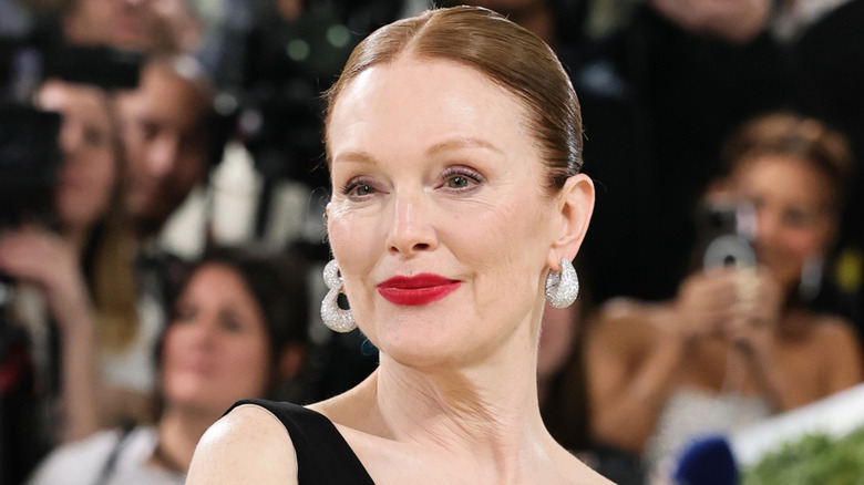 Julianne Moore smiling while posing at the 2026 Met Gala