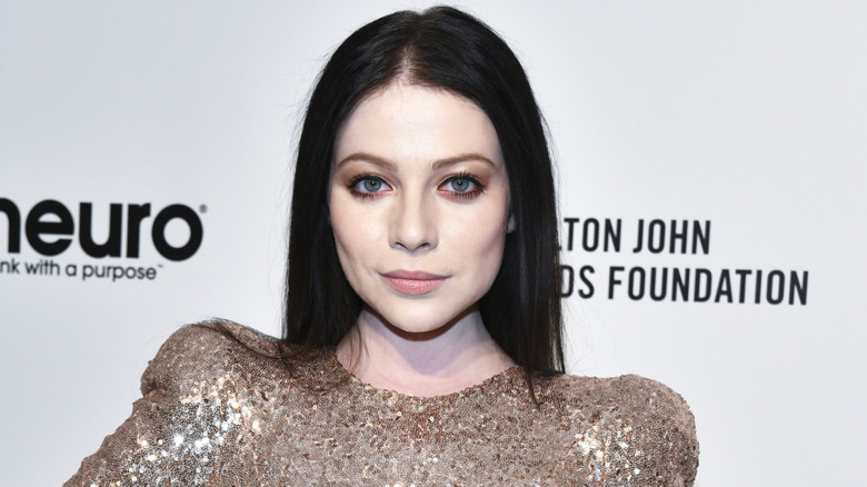 Michelle Trachtenberg posing for the cameras at a red carpet event