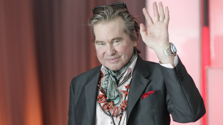 Val Kilmer waving at the cameras