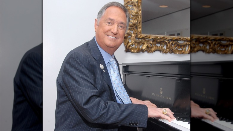 Neil Sadaka smiling at the piano