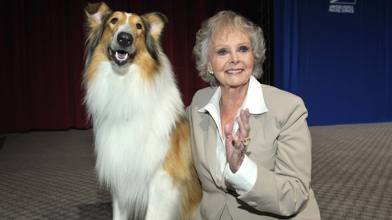 June Lockhart posing for photos with a dog