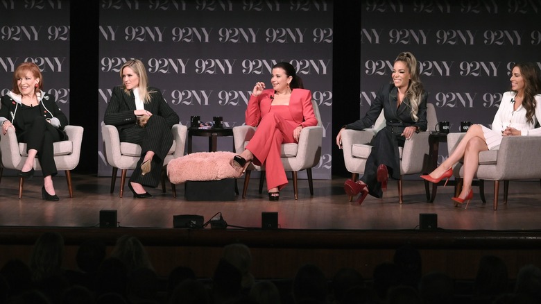 Joy Behar, Sara Haines, Ana Navarro, Sunny Hostin, and Alyssa Farah Griffin of 'The View' seated in armchairs on a stage