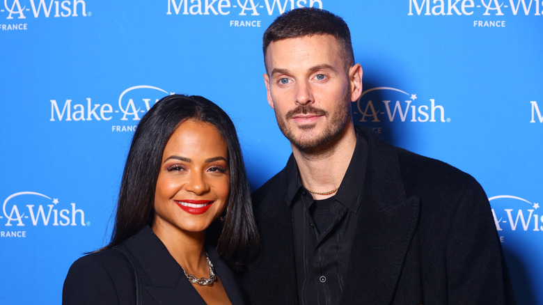 Christina Milan smiles with husband Matt Pokora