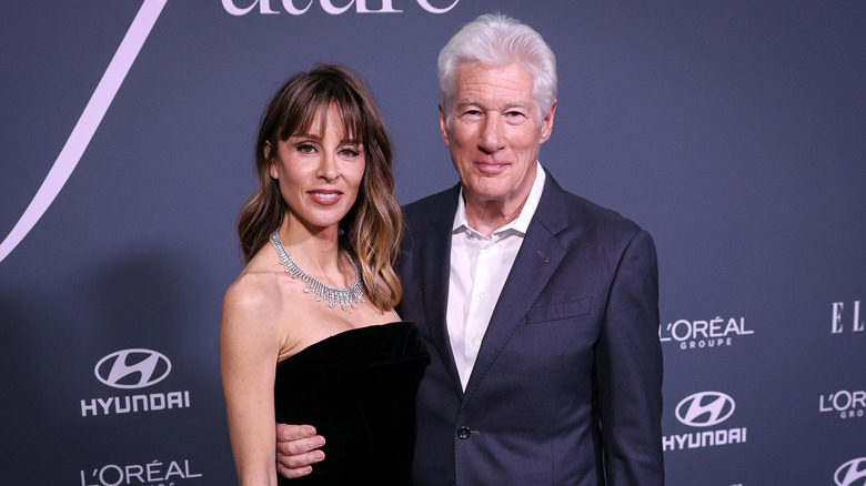 Alejandra Silve and Richard Gere smile together on the red carpet