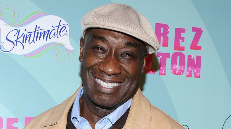 Michael Clarke Duncan smiling on the red carpet in 2012