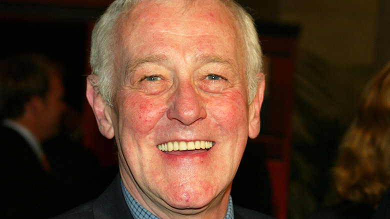 John Mahoney smiling at a red carpet event
