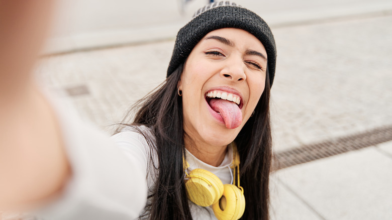 Grinning woman taking a selfie